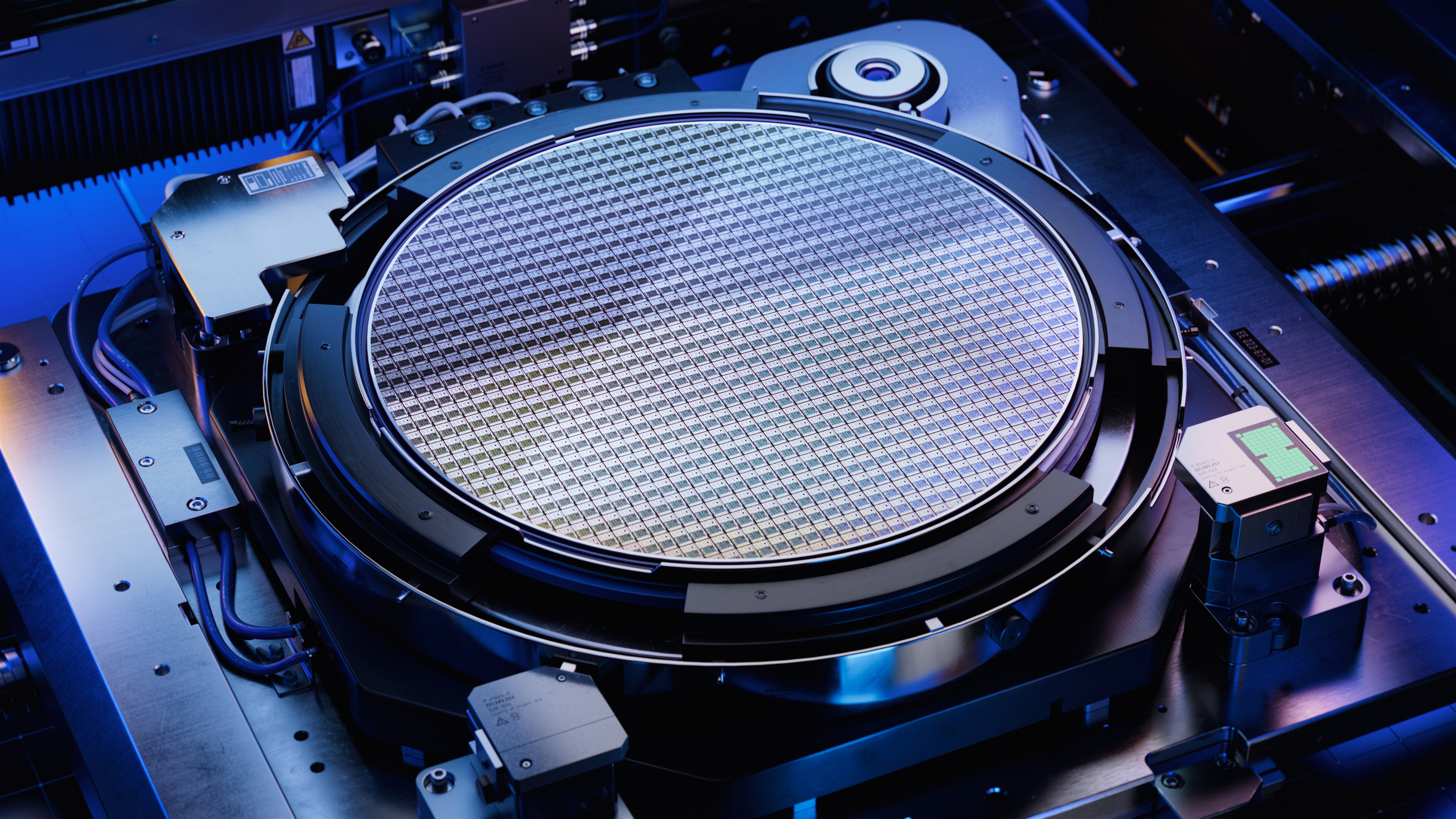 Top View of Silicon Wafer during Photolithography Process inside Complex Computer Chip Production Machine. Semiconductor Manufacturing at Fab or Foundry.