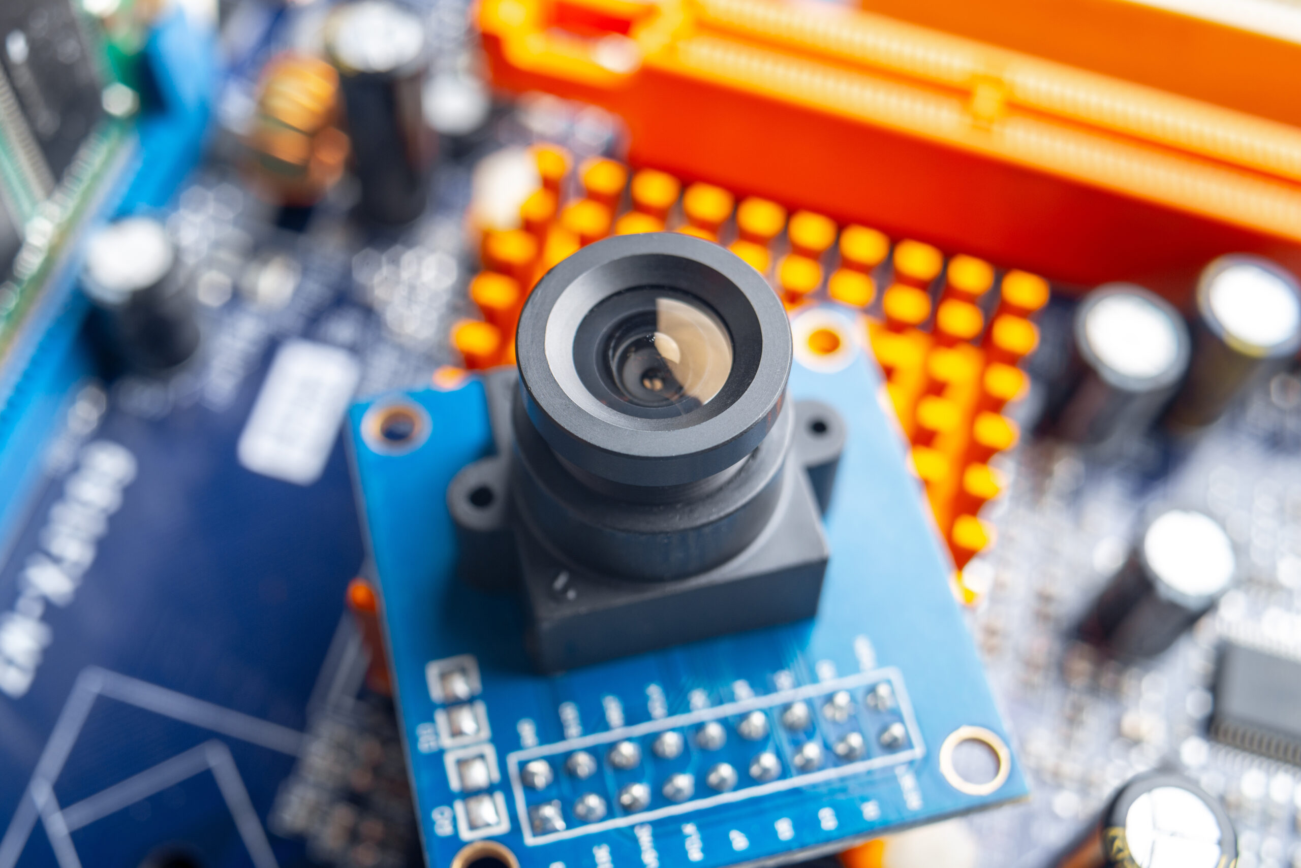 Camera with lens on electronic integrated circuit Board. Concept of high technology and robotics